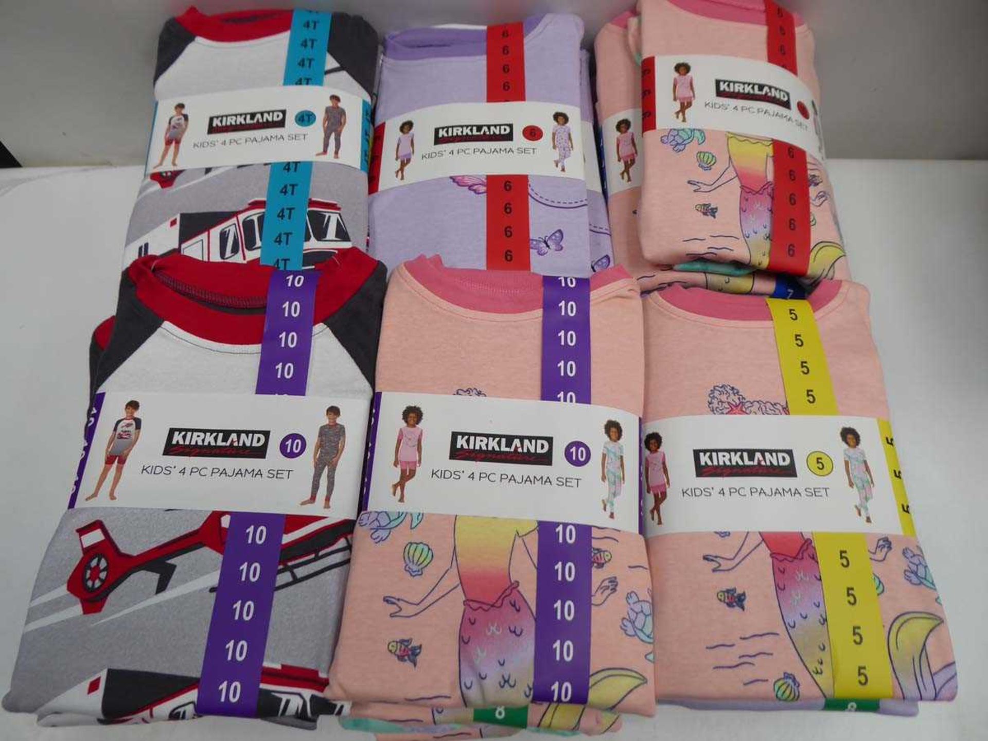 Approx. 30 Kirkland SIgnature kids 4 piece pyjama sets in various colours, sizes, and genders