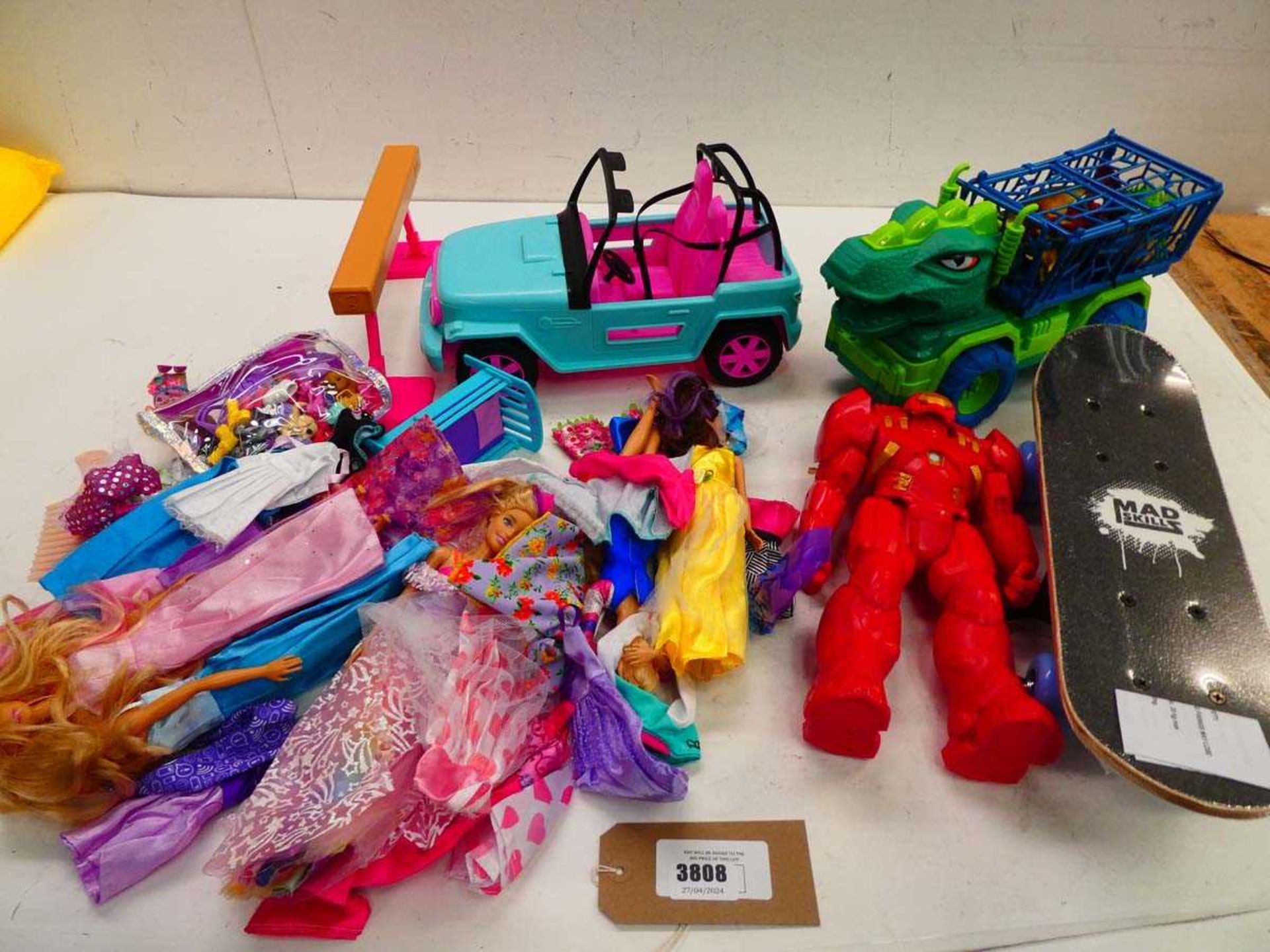 +VAT Selection of Barbie toys, dinosaur car, Iron Man toy and mini skateboard
