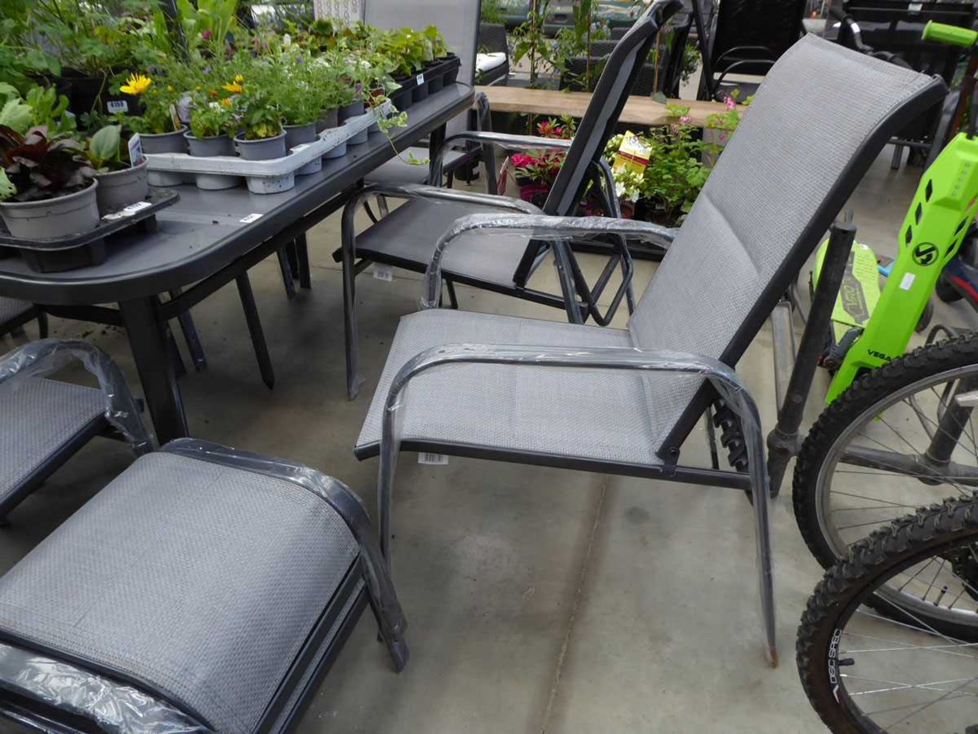 Rectangular metal framed glass topped table with 6 chairs, small round side table and 2 footstools - Image 2 of 2