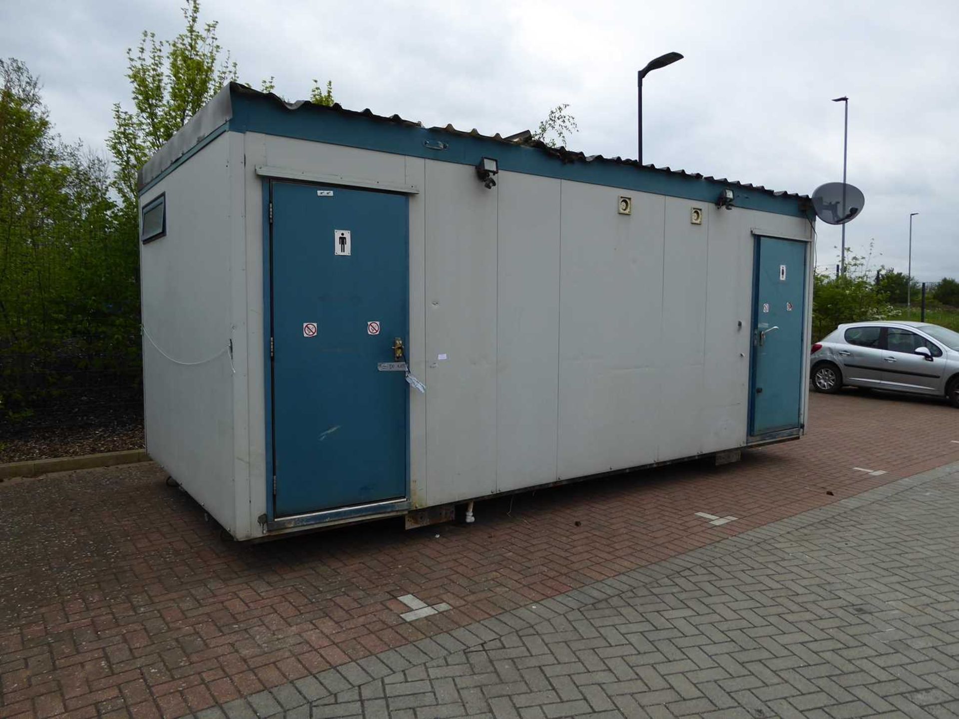 20ft x 9ft 6” metal clad portable toilet block comprising ladies and gents finished in blue and