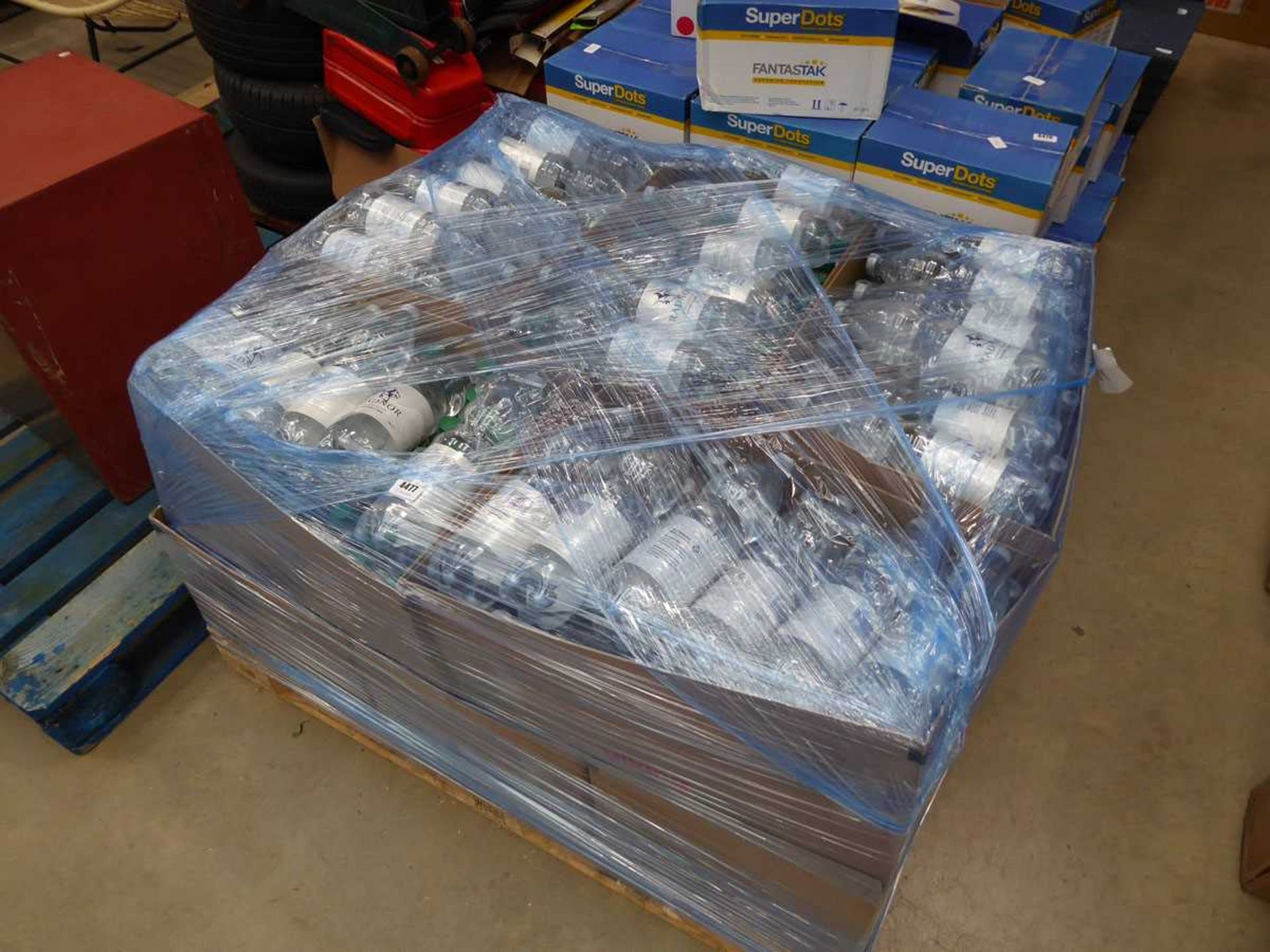 Pallet of sparkling water with March and April used by dates