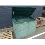 Green plastic storage shed