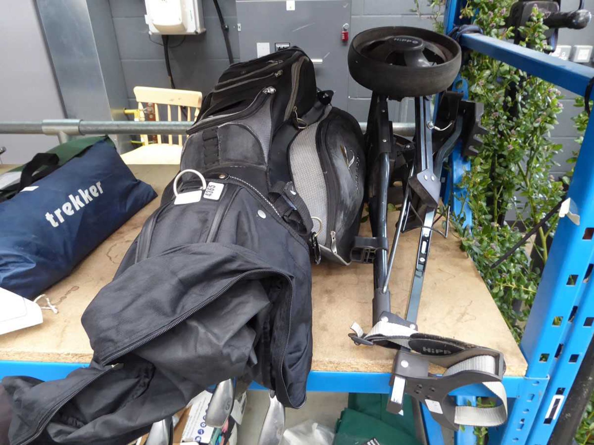 Power Caddy golf bag with assorted clubs and a folding trolley