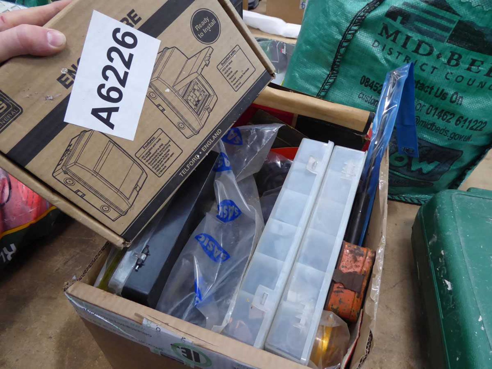 Green closure box and quantity of assorted fixings and car parts