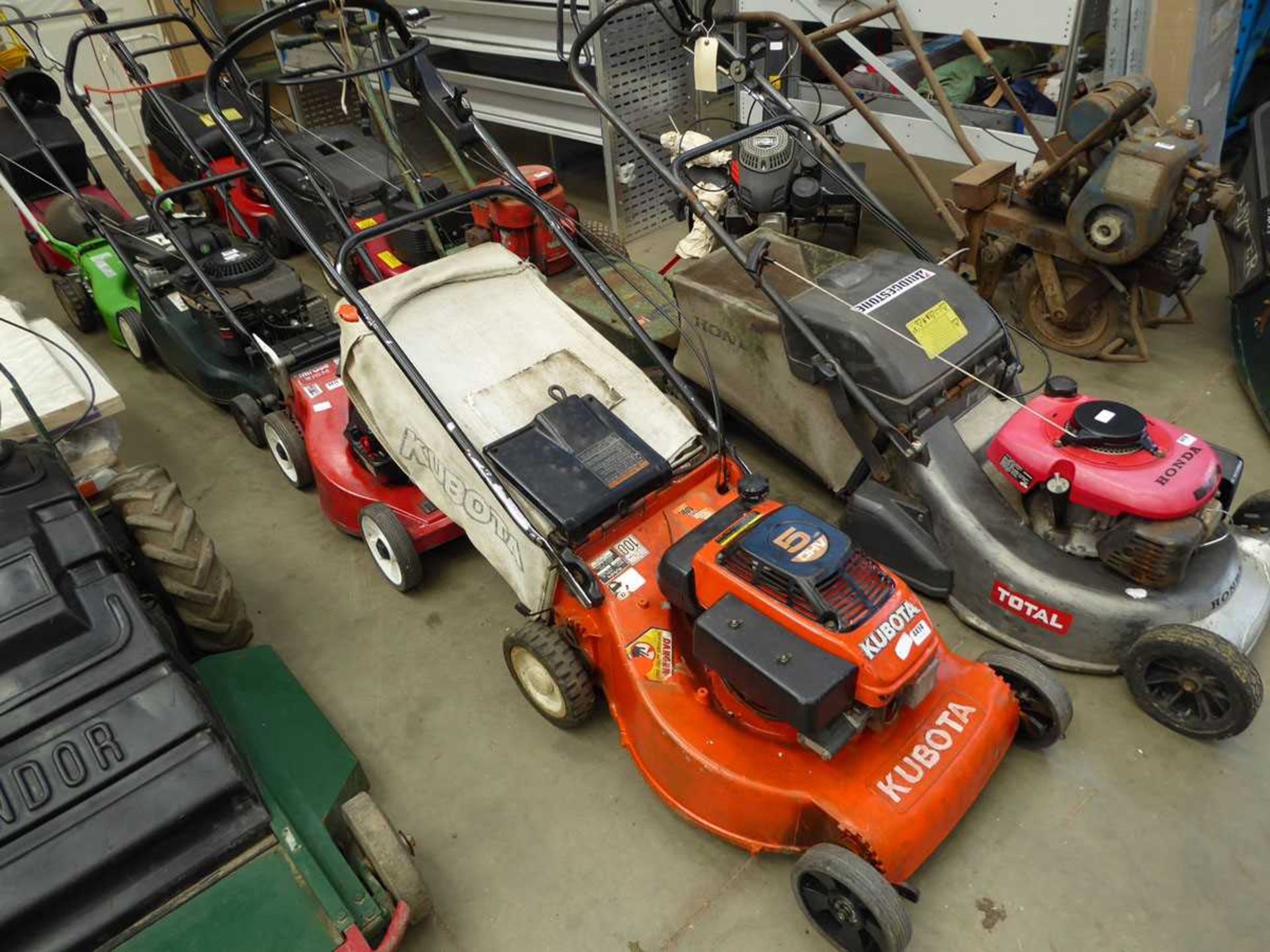 Kubota orange petrol powered rotary mower with grass box