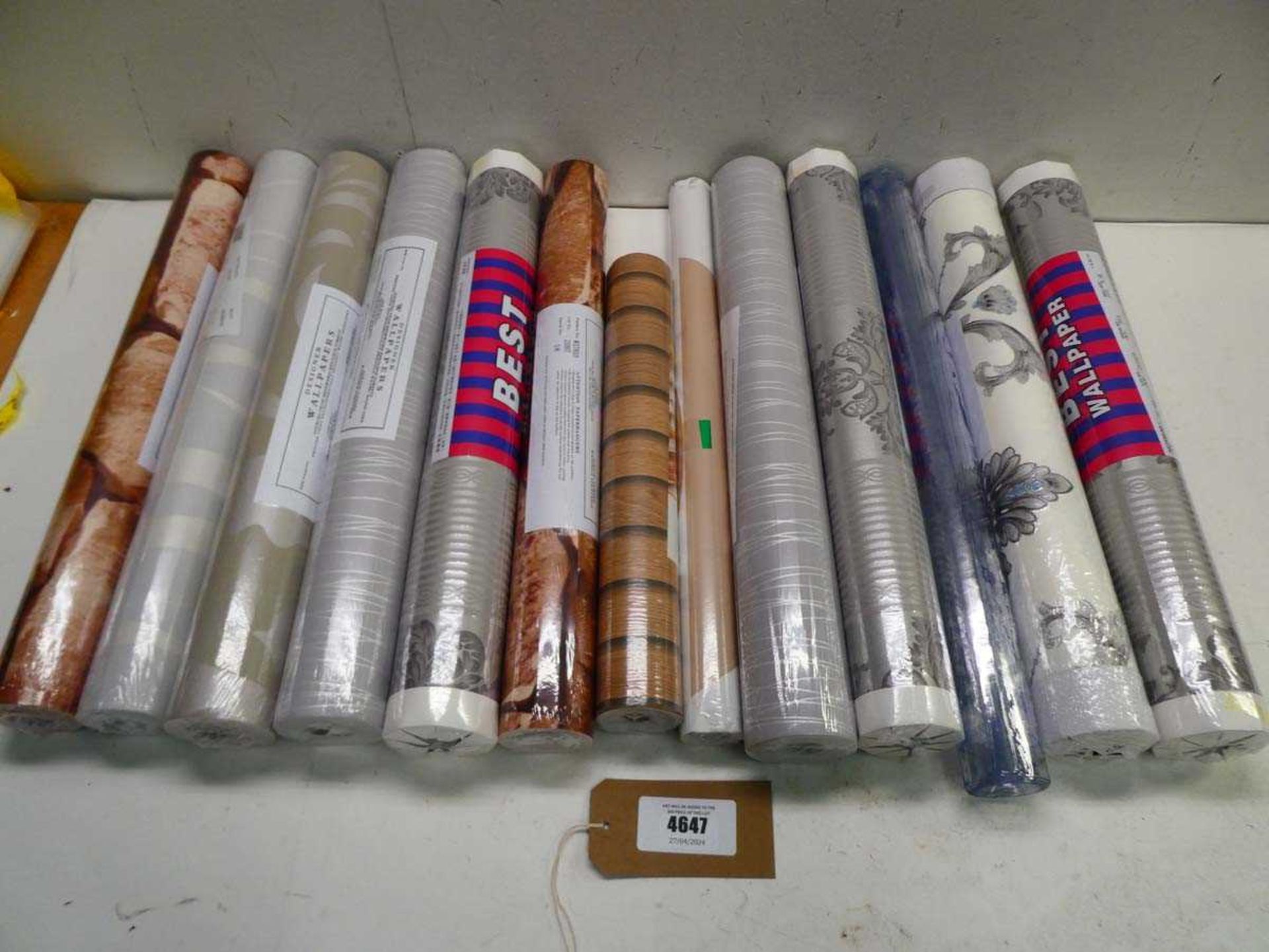 +VAT Quantity of wallpaper rolls in various designs plus a roll of clear vinyl