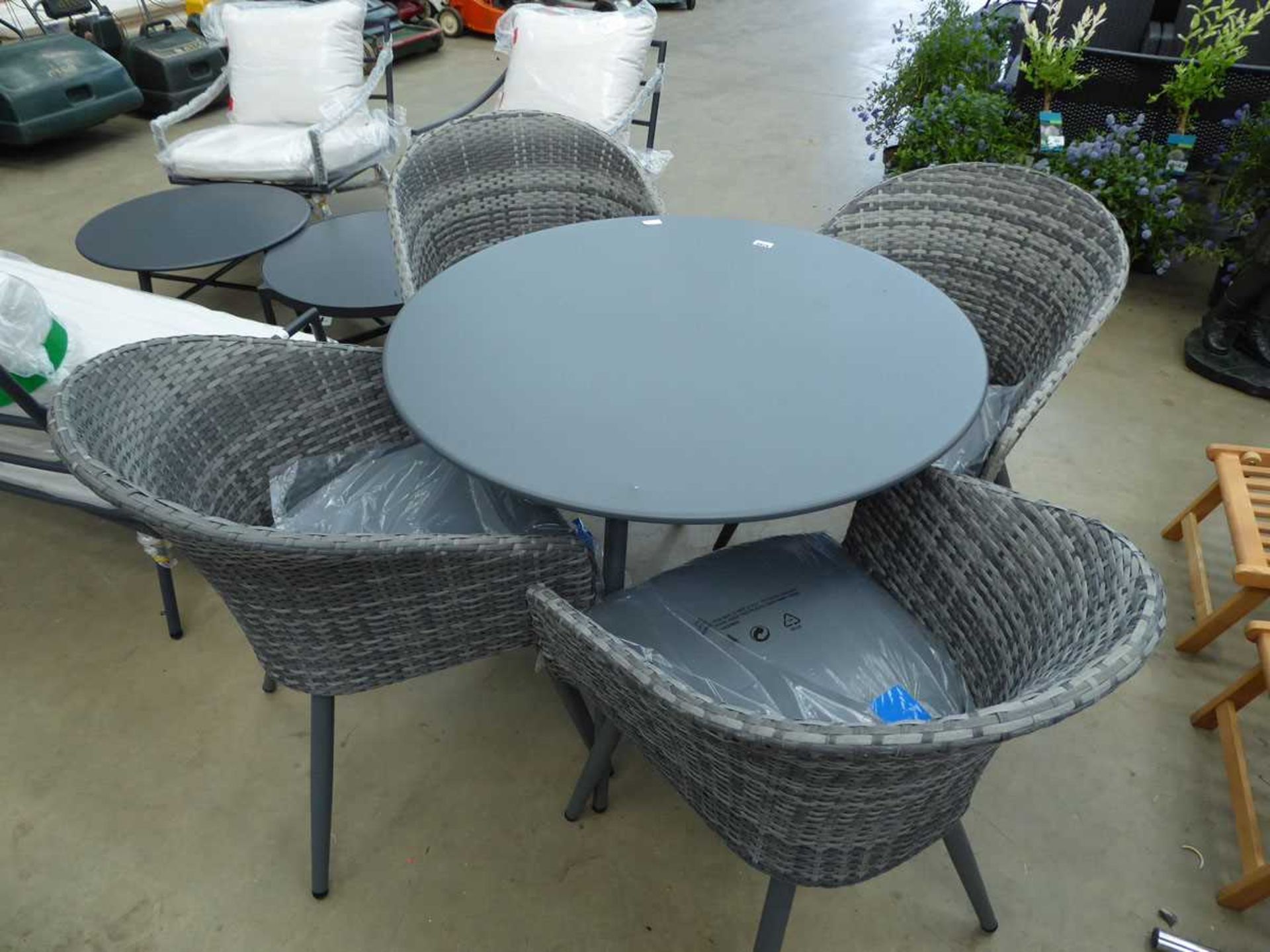 Grey round metal garden table and 4 rattan style tub chairs
