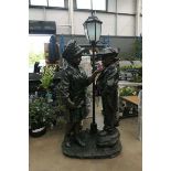 Metal garden ornament with 2 children and a lamp