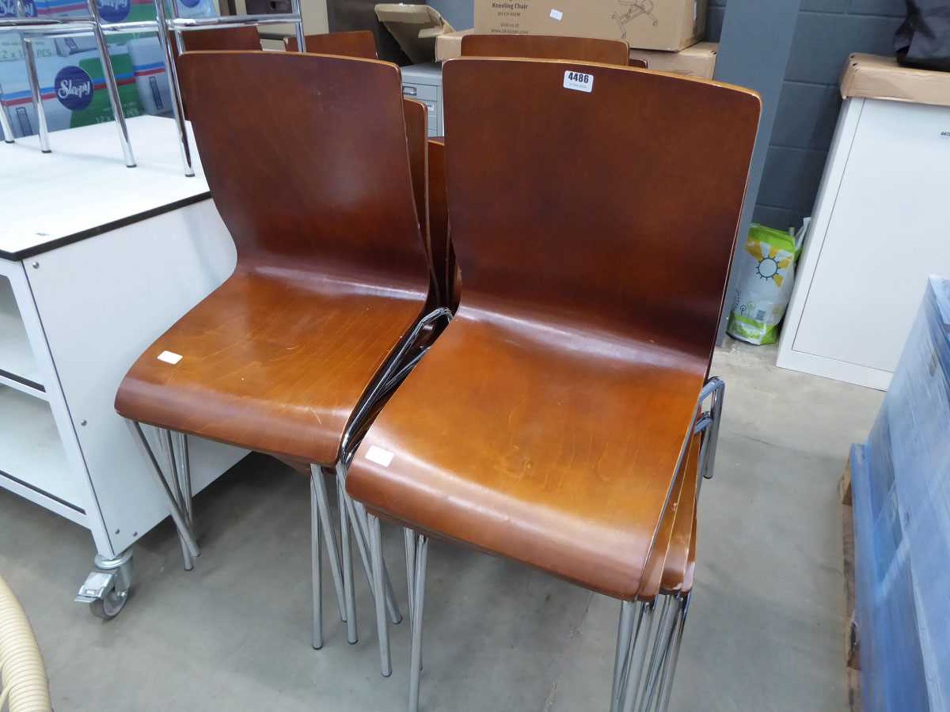 Approx 12 wooden seated chrome framed stacking chairs