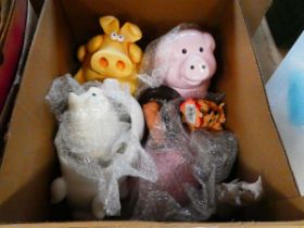 Box of piggy banks and other pig figures