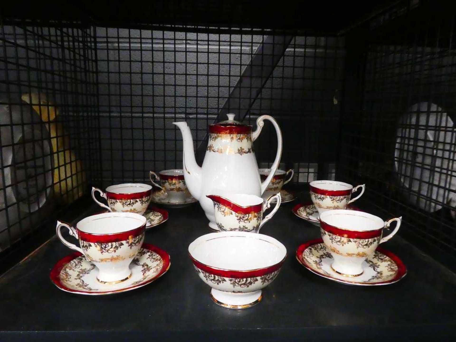 Cage containing Royal Standard floral patterned tea service