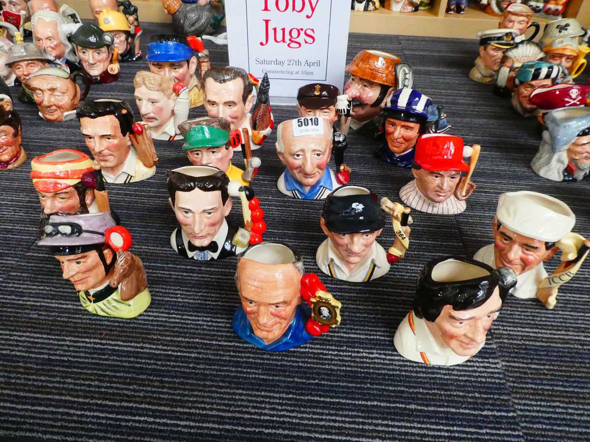 17 small Character Jugs, depicting manly sportsmen, to include W. G. Grace, Brian Johnston, baseball