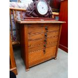 Small oak chest of four drawers with a fall front panel under