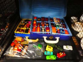 Cage containing play worn Matchbox die-cast vehicles