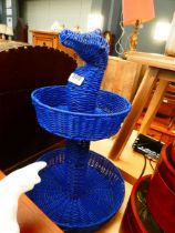 Seahorse shaped two tier fruit basket together with 3 fruit patterned lidded boxes and a wicker