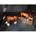 Cage containing Beswick horse with foal