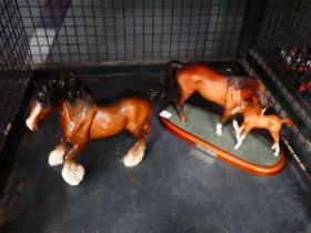 Cage containing Beswick horse with foal