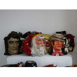 7 large character jugs depicting fictional characters, to include Phantom of the Opera, Bill