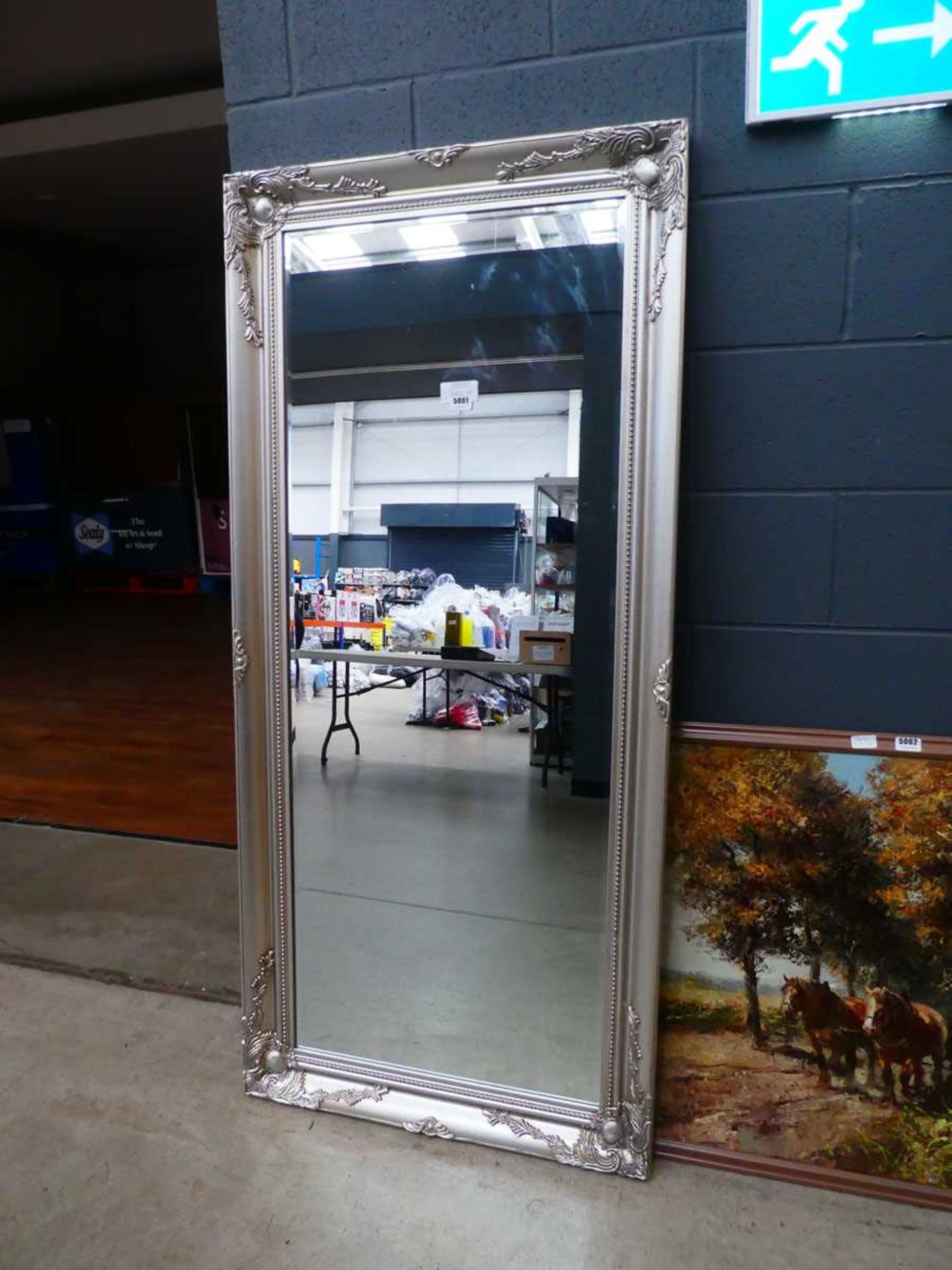 +VAT (10) Narrow rectangular bevelled mirror in silver painted frame
