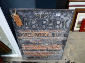 Large metal hotel car park sign