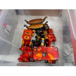 Box containing 2 Wade dragon boats plus a quantity of pottery cars No major chips and cracks. Some