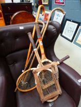 Three walking sticks plus three vintage tennis rackets