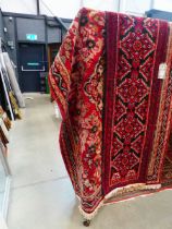 (3) Red floral Iranian carpet