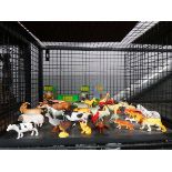 Cage containing plastic farmyard and wild animals