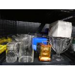 Cage containing glass vases, dishes, jugs and quartz clock