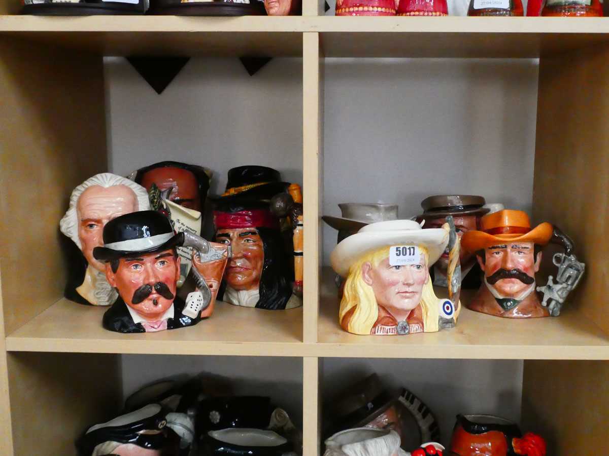 9 various sized Character Jugs depicting famous Americans, to include Annie Oakley, Doc Holliday