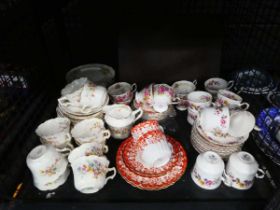 Cage containing Royal Stafford and other floral patterned crockery