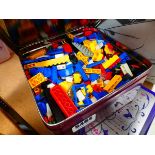 2 tins containing LEGO pieces
