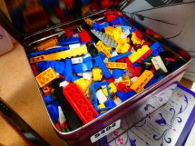 2 tins containing LEGO pieces