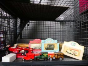 Cage of die cast vans and Formula One car