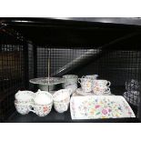 Cage containing a large quantity of Minton Haddon Hall patterned crockery