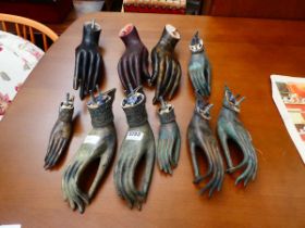 Quantity of carved wooden and metal Balinese ornamental hands