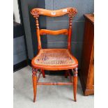 Carved Edwardian bedroom chair with wicker seat