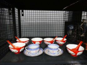 Cage containing export Chinese cups and saucers plus fruit bowls and spoons