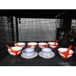 Cage containing export Chinese cups and saucers plus fruit bowls and spoons