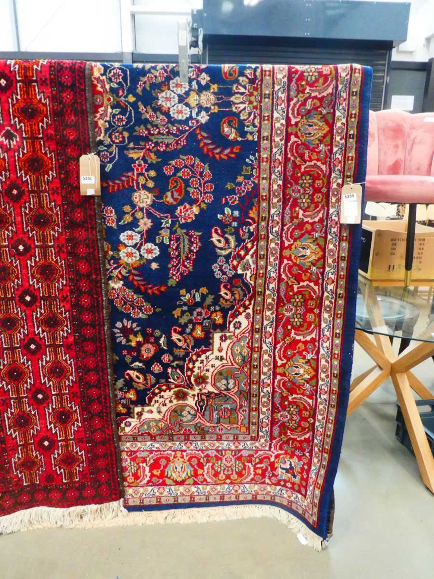 (8) Indian woollen carpet with floral pattern and navy blue border