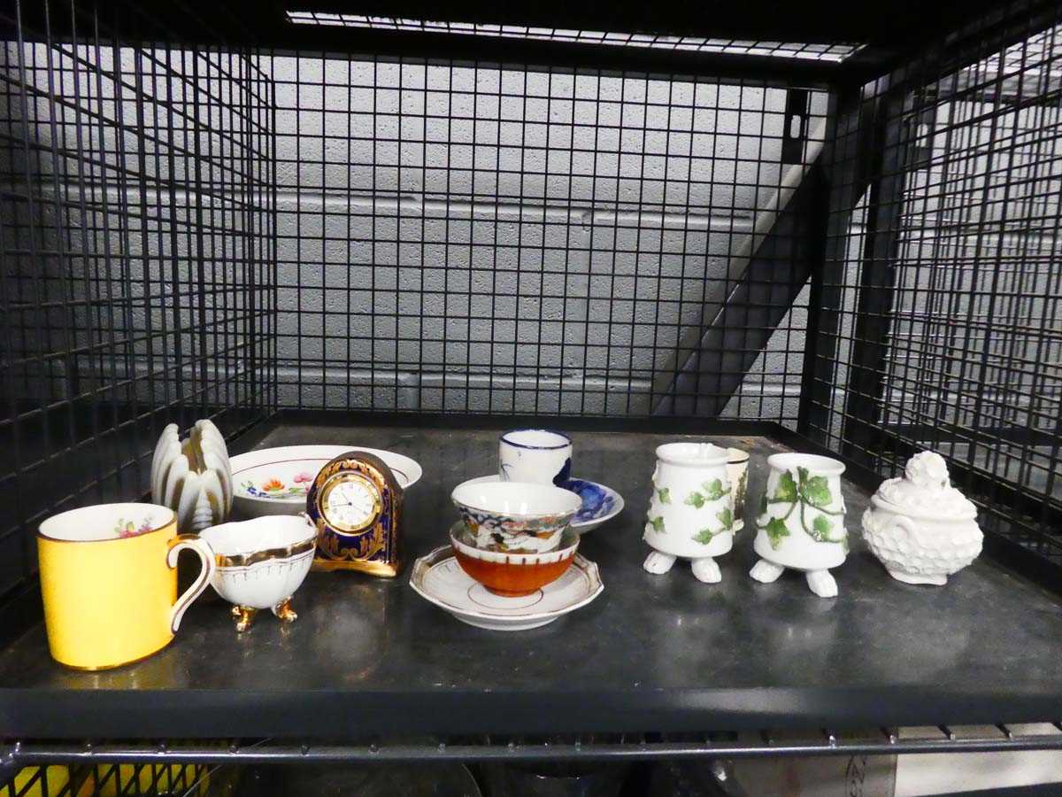Cage containing miniature quartz clock, various bowls, dishes and china