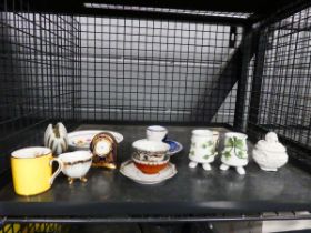 Cage containing miniature quartz clock, various bowls, dishes and china