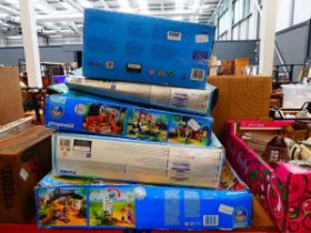 Stack of Playmobil and other children's games