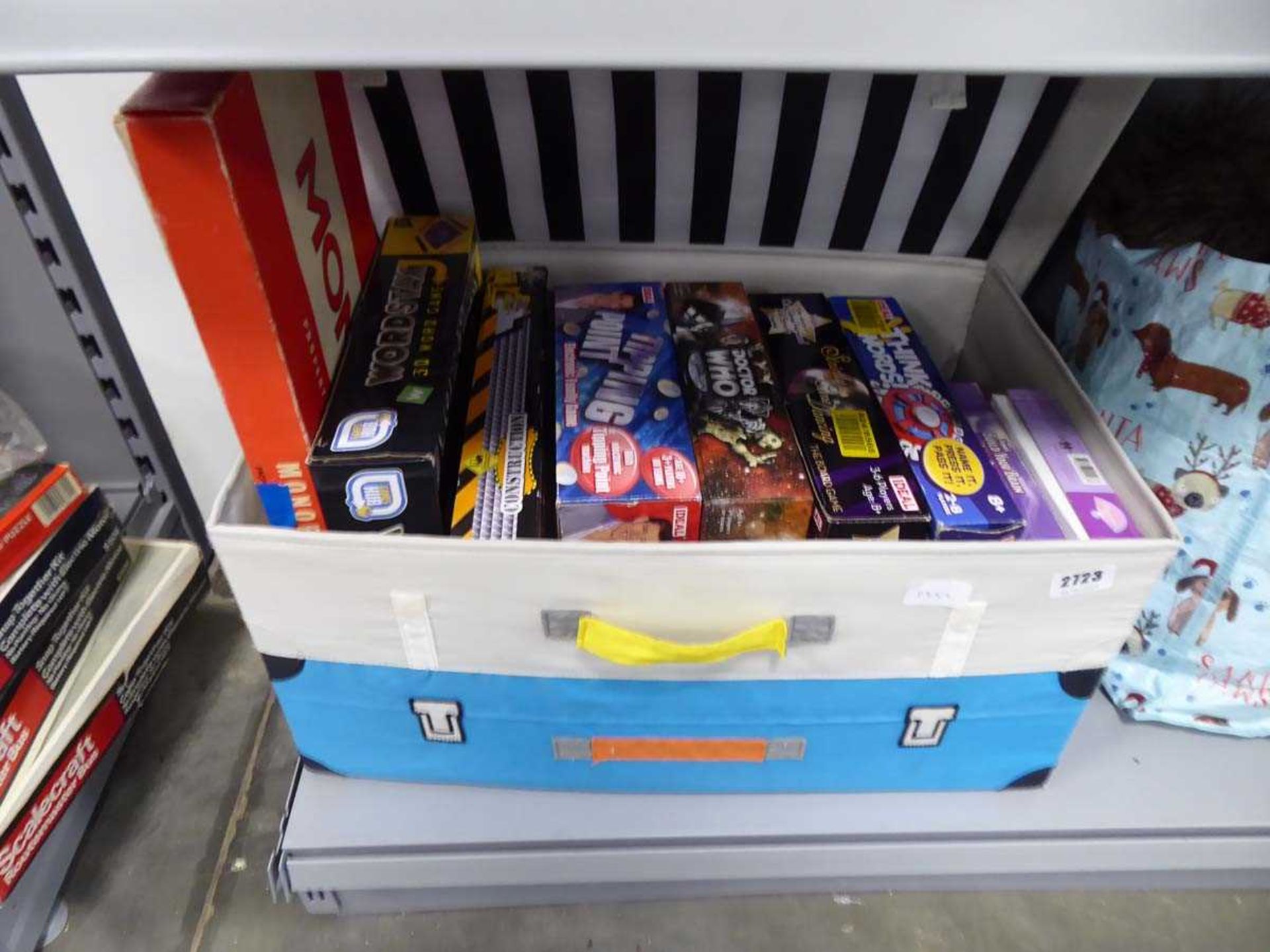 Box containing various board games