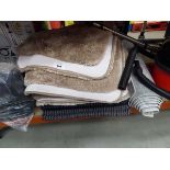 +VAT Large stack of assorted rugs and mats