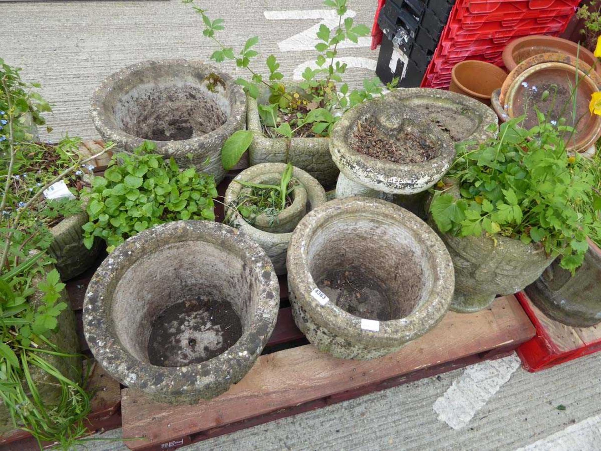 Pallet of concrete garden pots