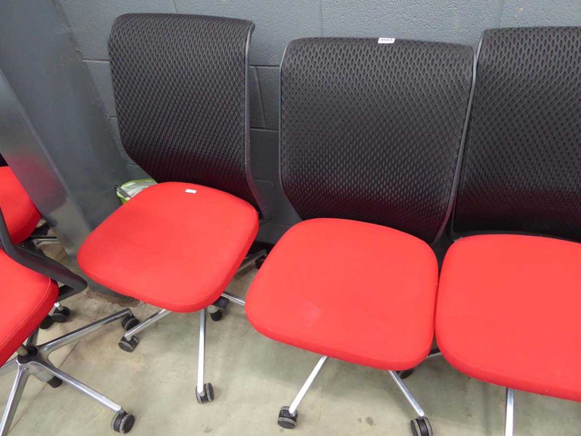 2 red cloth mesh back swivel chairs