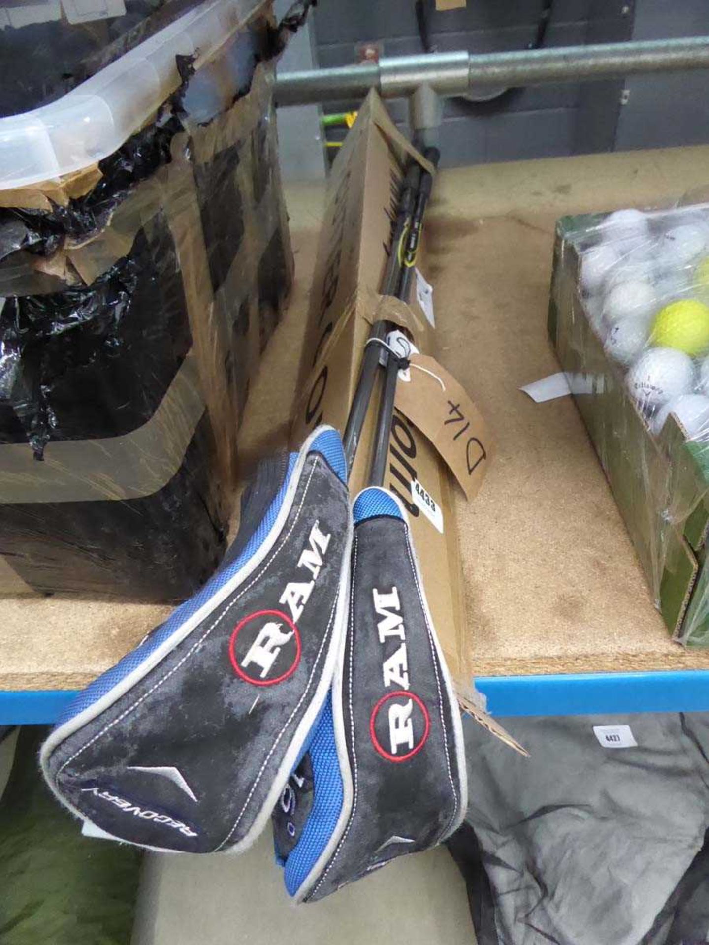 2 assorted golf clubs