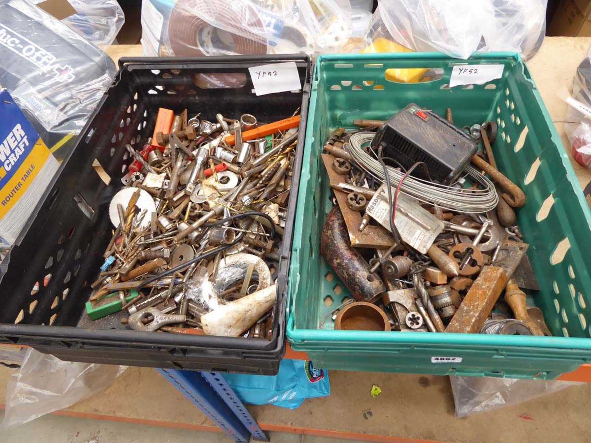 2 crates of assorted items inc. drill bits, sockets, cable, charger, etc.