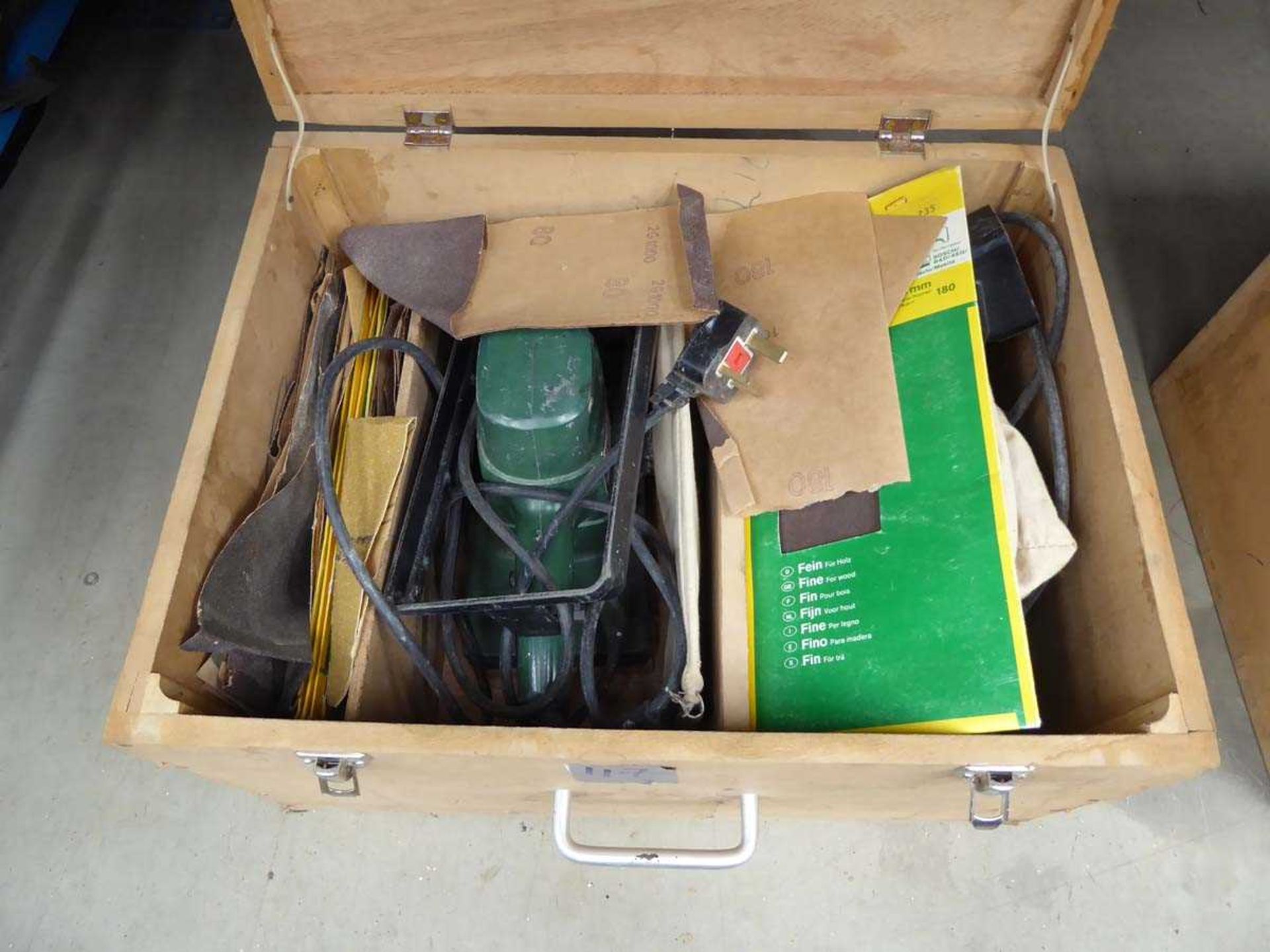 Box containing electric sander complete with a large qty of sanding pads and an electric plane